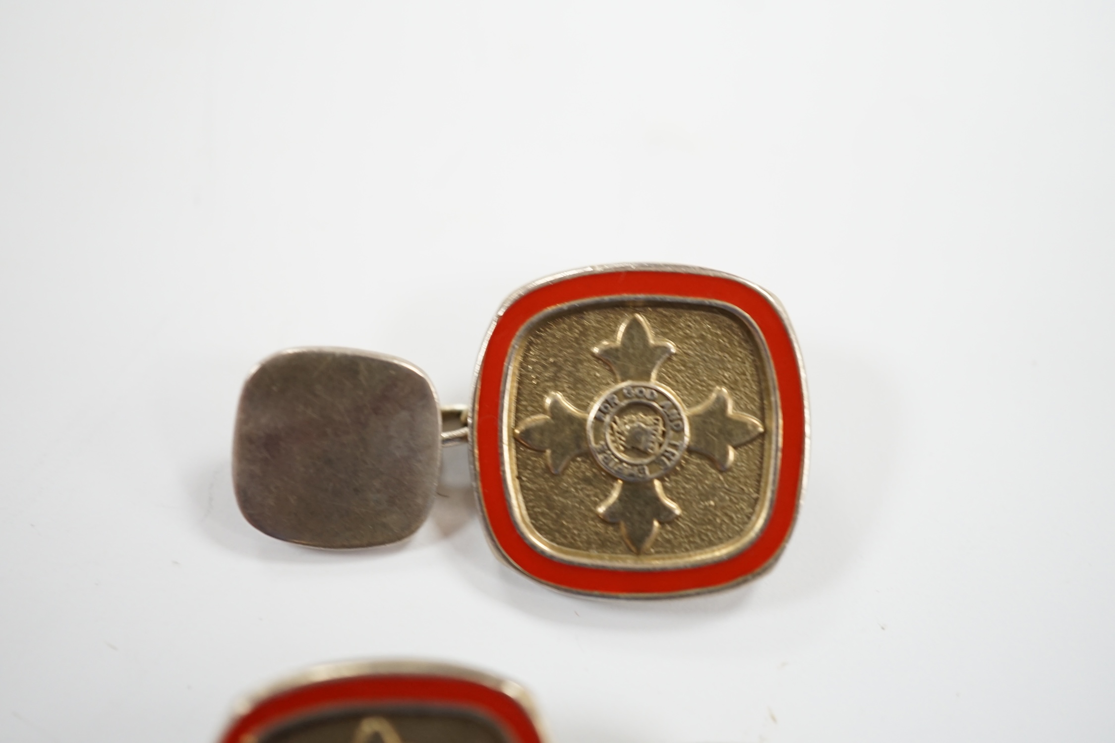 A modern pair of silver and red enamel cufflinks, embossed with the Order of The British Empire, by Toye, Kenning & Spencer, 19mm.